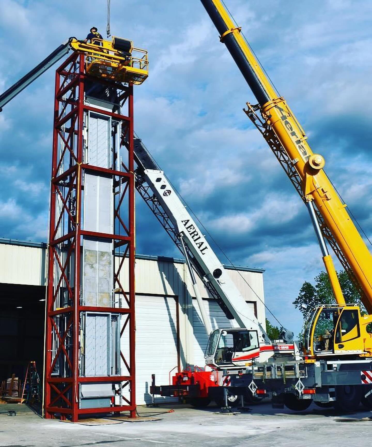 a crane is lifting a building into place