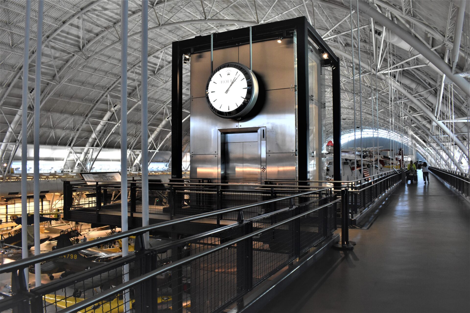 a train station with a large clock on the wall