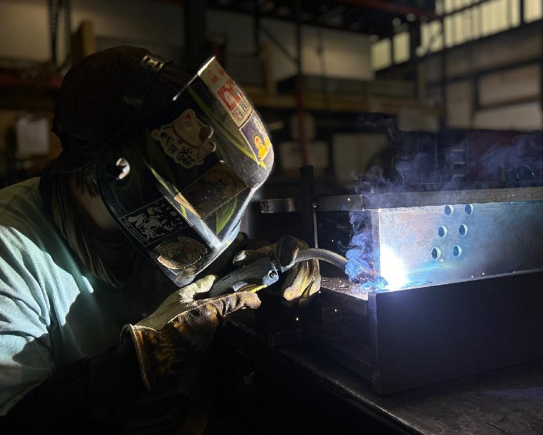 a welder working on a piece of metal