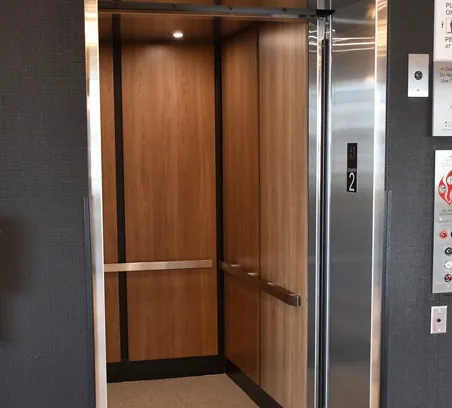 an elevator with a sliding door in a building